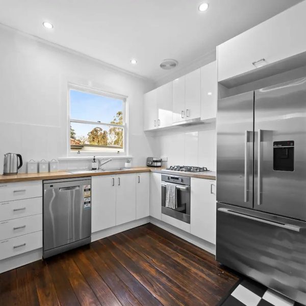 Stainless Steel Appliances in a White Kitchen